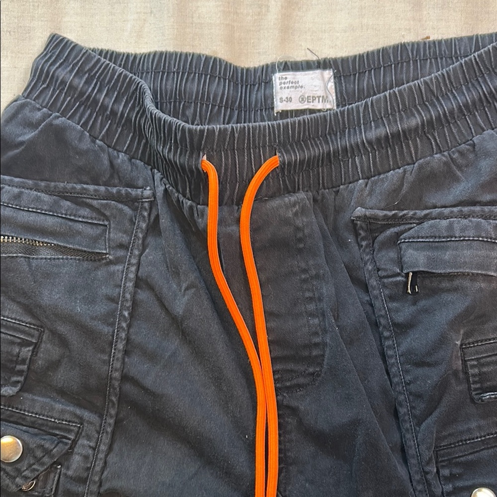 Stylish Black Cargo Pants with Vibrant Orange Drawstring